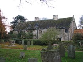 A picture of a stone manor house